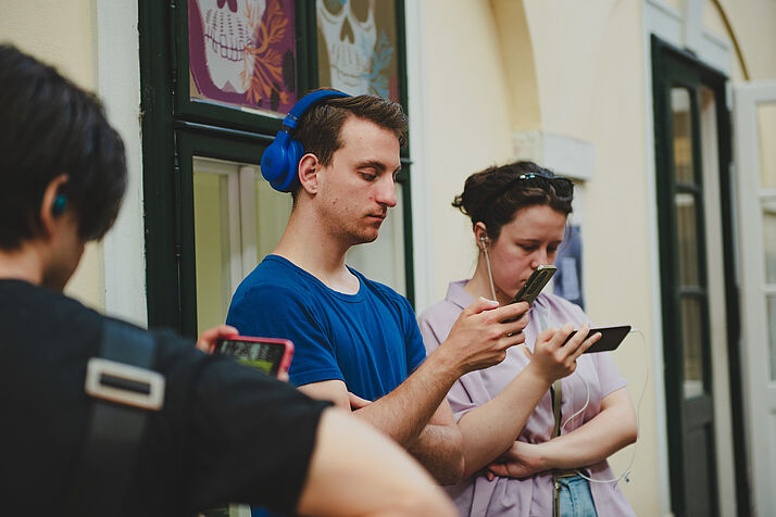 Visitors watching the films on their smartphones